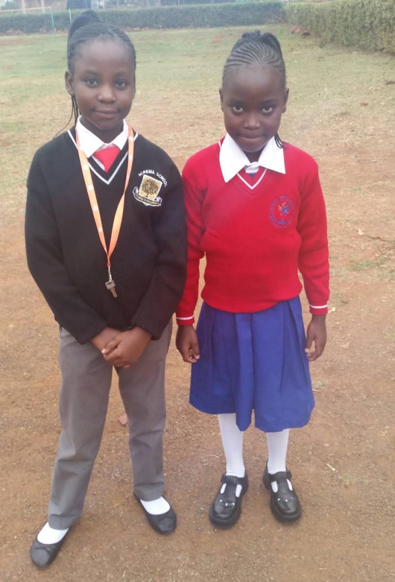 My cousin and I posing for a first-day-of-school photo. It was my first day of class four and her first day of  class 3. Photo of Courtesy of Martha Luvanda